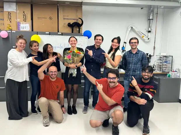 The group celebrating Kayla McArthur's MSc defence